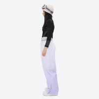 
                  
                    Women's breathable ski jacket set in pastel colors - lavender snow pants, on-model side view, for powder and piste riding
                  
                