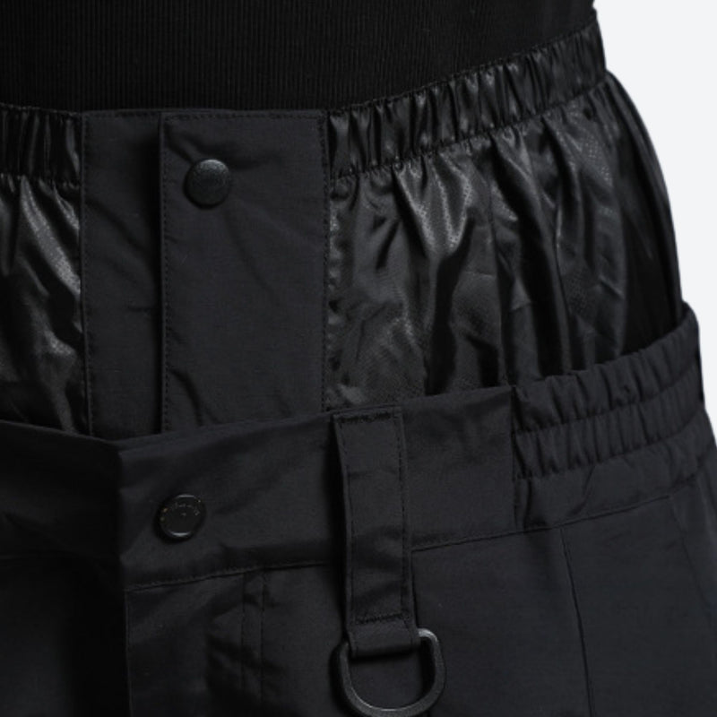 Men's breathable 3-layer ski pants with mesh vents - black, waistband snap close-up detail, for skiing and snowboarding