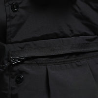 
                  
                    Men's adjustable snowboard cargo pants with gaiters - black, pocket zip close-up detail, for skiing and snowboarding
                  
                