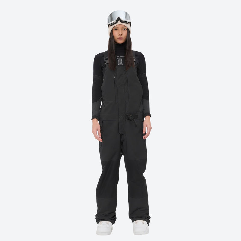 Insulated bib snow pants for women - black bib pants, on-model front view, for cold-weather winter sports