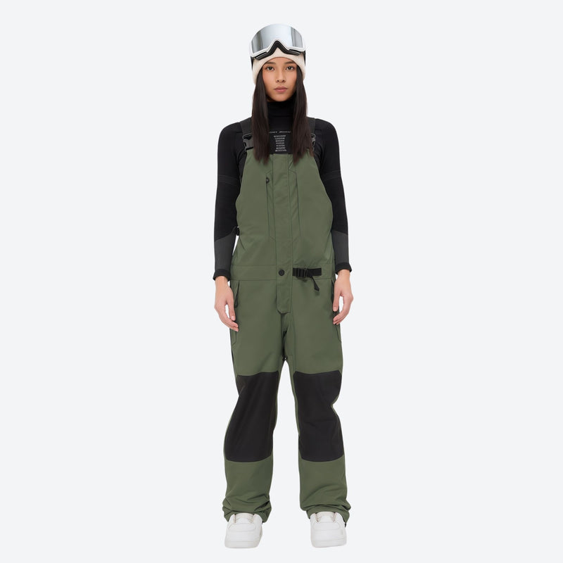 Women's adjustable ski pants with suspenders - olive green bib pants, on-model front view, for cold-weather winter sports