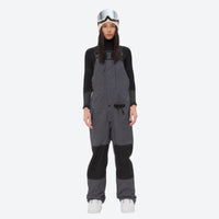 
                  
                    Insulated bib snow pants for women - gray bib pants, on-model front view, for resort and backcountry days
                  
                