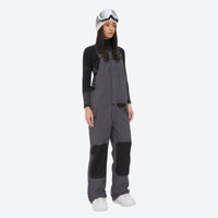 
                  
                    Women's adjustable ski pants with suspenders - gray bib pants, on-model front view, for deep powder winter days
                  
                