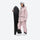 Women's 3L waterproof suspender snow pants - pink, on-model front with upright snowboard, for skiing and snowboarding