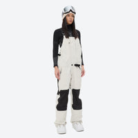 
                  
                    Insulated bib snow pants for women - white bib pants, on-model front view, for skiing and snowboarding
                  
                