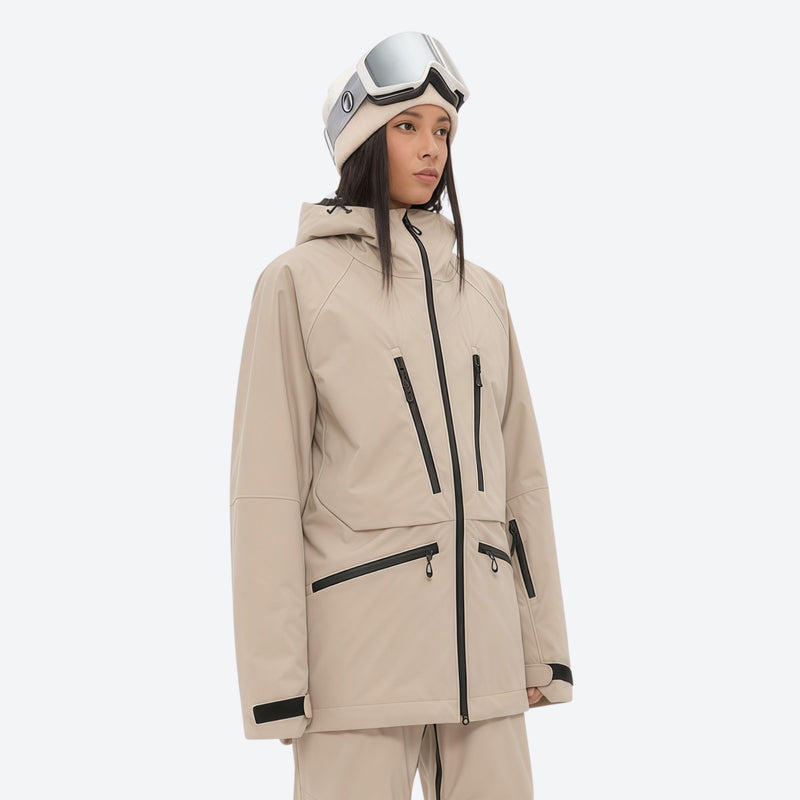Women's adjustable ski pants with suspenders - tan, on-model three-quarter front view, for resort and backcountry days