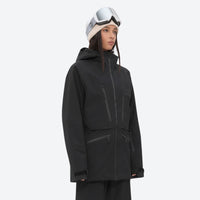 
                  
                    Women's adjustable ski pants with suspenders - black, on-model three-quarter front view, for cold-weather winter sports
                  
                