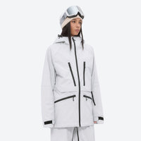 
                  
                    Women's adjustable ski pants with suspenders - white, on-model three-quarter front view, for cold-weather winter sports
                  
                