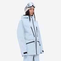 
                  
                    Women's adjustable ski pants with suspenders - ice blue, on-model three-quarter front view, for resort and backcountry days
                  
                