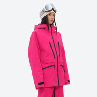 
                  
                    Women's adjustable ski pants with suspenders - magenta, on-model three-quarter front view, for resort and backcountry days
                  
                
