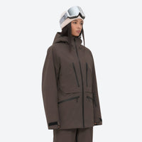 
                  
                    Insulated bib snow pants for women - coffee brown, on-model three-quarter front view, for cold-weather winter sports
                  
                