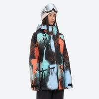 
                  
                    Women's adjustable ski pants with suspenders - orange and blue abstract print, for cold-weather winter sports
                  
                