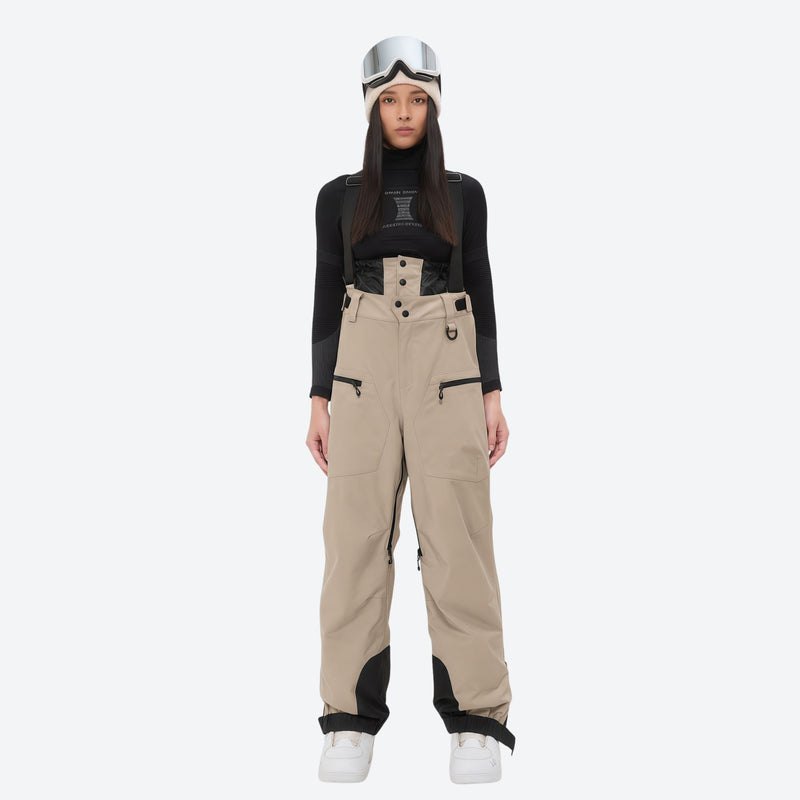 Women's 3L waterproof suspender snow pants - tan bib pants, on-model front view, for deep powder winter days