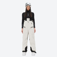 
                  
                    Women's 3L waterproof suspender snow pants - cream, on-model front view, for skiing and snowboarding
                  
                