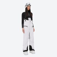 
                  
                    Insulated bib snow pants for women - white bib pants, on-model front view, for resort and backcountry days
                  
                