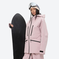 
                  
                    Women's adjustable ski pants with suspenders - pink, on-model front with upright snowboard, for deep powder winter days
                  
                