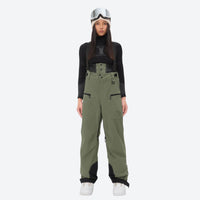 
                  
                    Women's 3L waterproof suspender snow pants - olive green bib pants, on-model front view, for deep powder winter days
                  
                