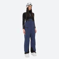 
                  
                    Insulated bib snow pants for women - navy bib pants, on-model front view, for resort and backcountry days
                  
                