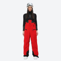 
                  
                    Women's adjustable ski pants with suspenders - red bib pants, on-model front view, for skiing and snowboarding
                  
                