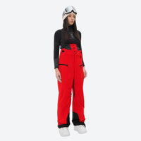 
                  
                    Women's 3L waterproof suspender snow pants - red bib pants, on-model front view, for resort and backcountry days
                  
                