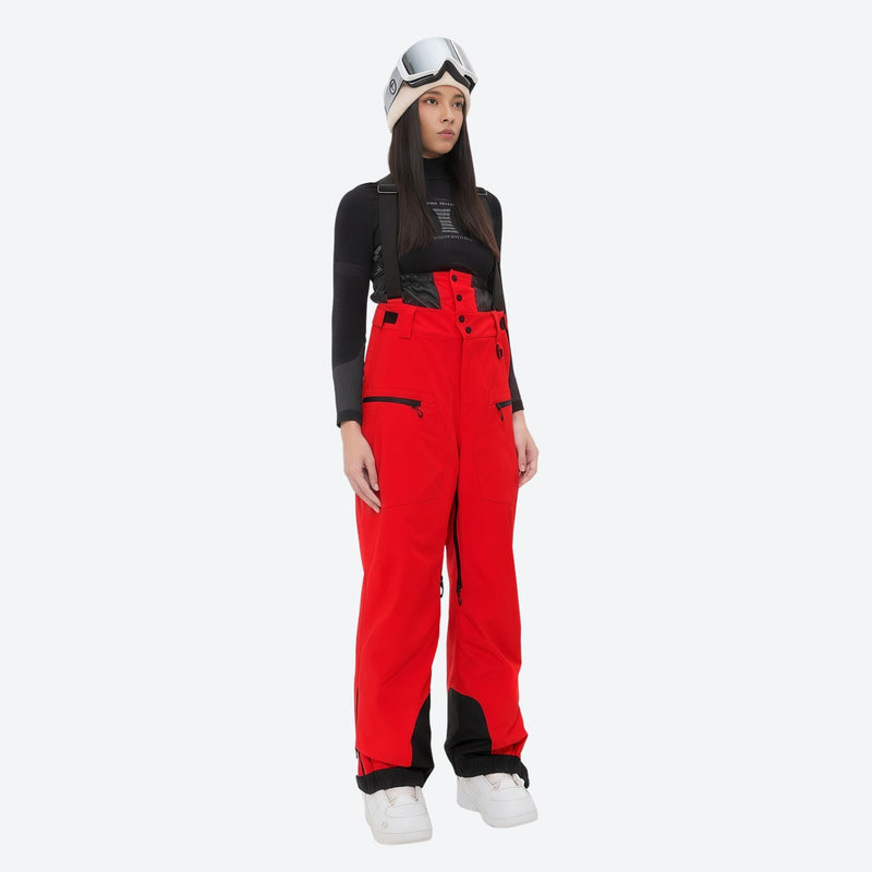 Women's 3L waterproof suspender snow pants - red bib pants, on-model front view, for resort and backcountry days