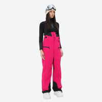
                  
                    Insulated bib snow pants for women - magenta bib pants, on-model front view, for cold-weather winter sports
                  
                