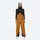 Women's adjustable ski pants with suspenders - mustard amber bib pants, on-model front view, for deep powder winter days