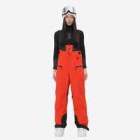 
                  
                    Women's 3L waterproof suspender snow pants - red bib pants, on-model front view, for skiing and snowboarding
                  
                