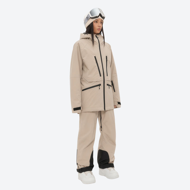 Women's 3L waterproof suspender snow pants - tan, on-model three-quarter front view, for resort and backcountry days