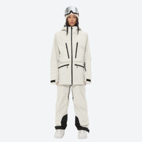 
                  
                    Women's adjustable ski pants with suspenders - cream, on-model front view, for deep powder winter days
                  
                