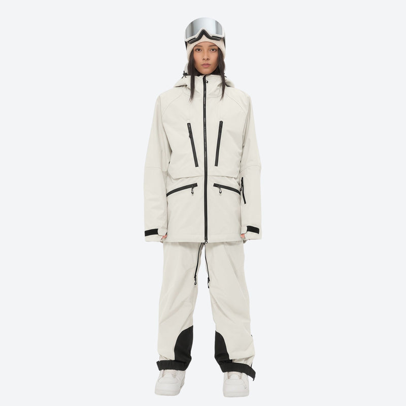 Women's adjustable ski pants with suspenders - cream, on-model front view, for deep powder winter days