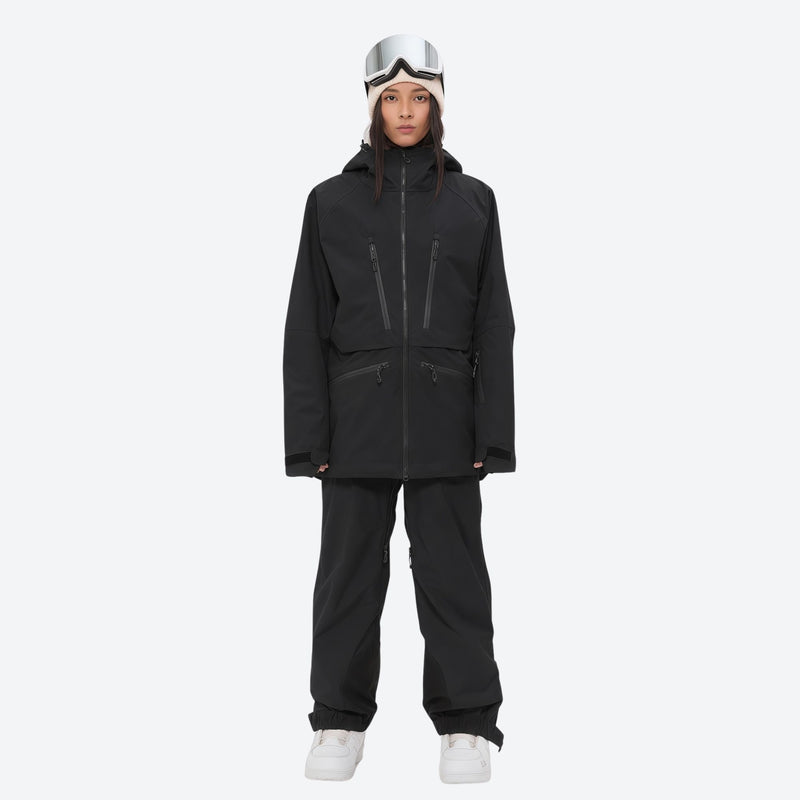 Women's adjustable ski pants with suspenders - black, on-model front view, for deep powder winter days