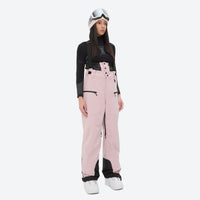 
                  
                    Women's 3L waterproof suspender snow pants - pink bib pants, on-model front view, for resort and backcountry days
                  
                