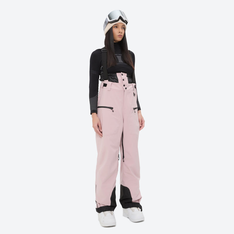 Women's 3L waterproof suspender snow pants - pink bib pants, on-model front view, for resort and backcountry days