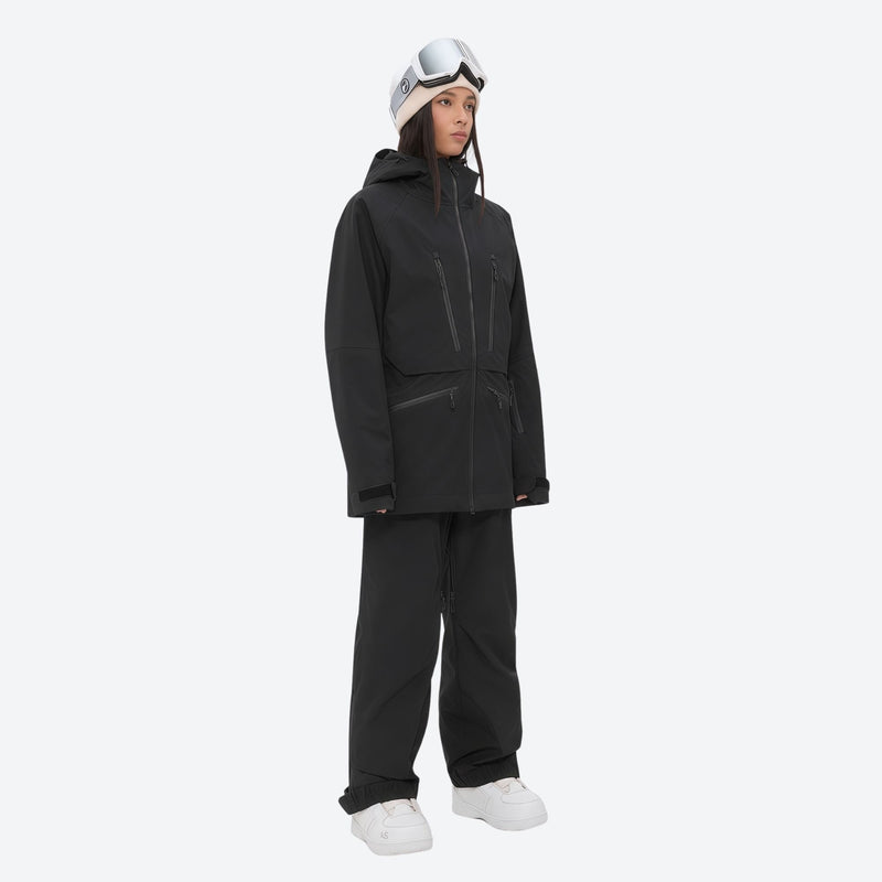 Women's 3L waterproof suspender snow pants - black, on-model three-quarter front view, for cold-weather winter sports