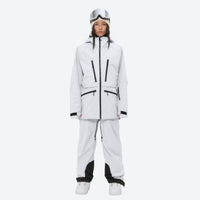 
                  
                    Women's adjustable ski pants with suspenders - white, on-model front view, for deep powder winter days
                  
                