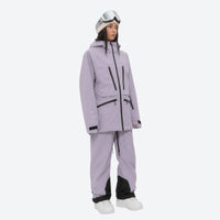 
                  
                    Women's 3L waterproof suspender snow pants - lavender, on-model three-quarter front view, for resort and backcountry days
                  
                