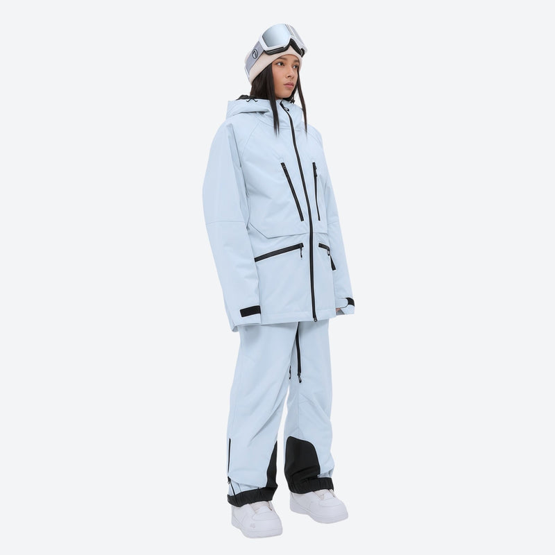 Women's 3L waterproof suspender snow pants - ice blue, on-model three-quarter front view, for resort and backcountry days