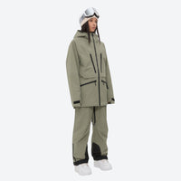 
                  
                    Women's 3L waterproof suspender snow pants - olive green, on-model three-quarter front view, for resort and backcountry days
                  
                