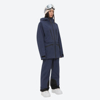 
                  
                    Women's 3L waterproof suspender snow pants - navy, on-model three-quarter front view, for cold-weather winter sports
                  
                