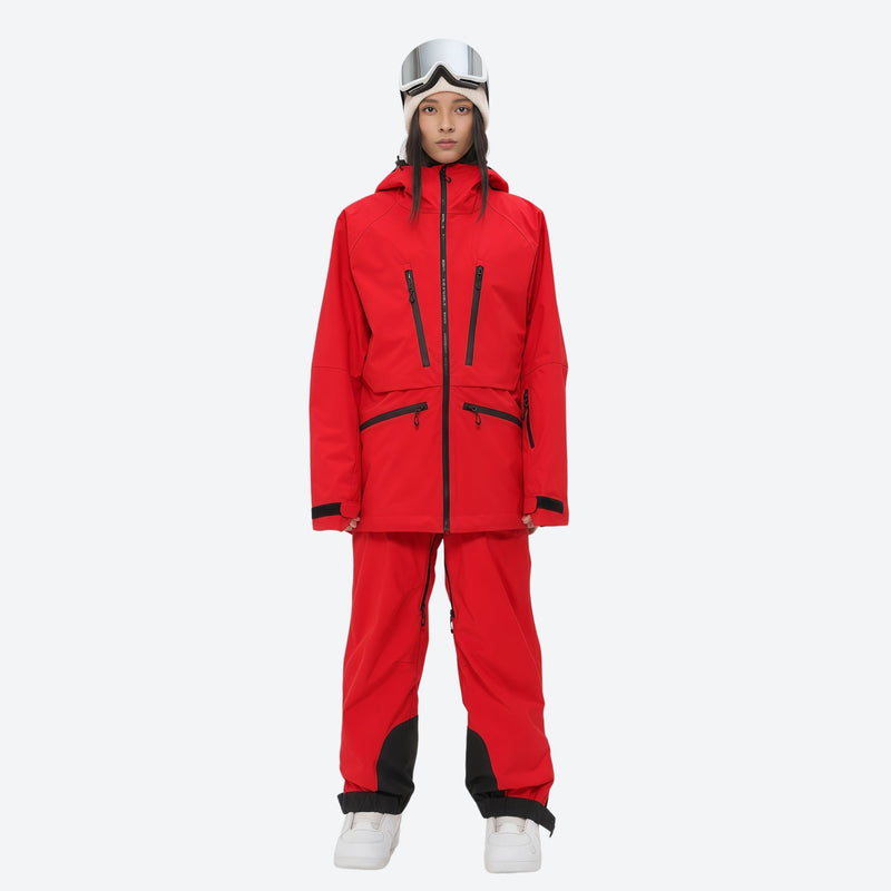 Insulated bib snow pants for women - red, on-model front view, for deep powder winter days
