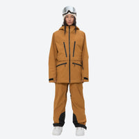 
                  
                    Insulated bib snow pants for women - mustard amber, on-model front view, for skiing and snowboarding
                  
                