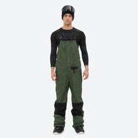 
                  
                    Men's 3L waterproof suspender snow pants - olive green bib pants with black knee patches, for cold-weather winter sports
                  
                