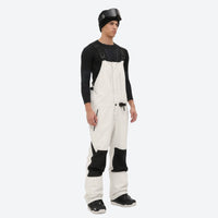 
                  
                    Men's 3L waterproof suspender snow pants - white bib pants with black knee patches, for deep powder winter days
                  
                