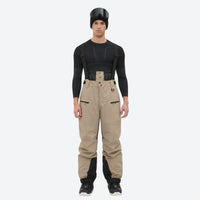 
                  
                    Insulated bib snow pants for men - tan bib pants, on-model front view, for deep powder winter days
                  
                