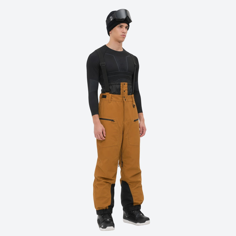 Men's adjustable ski pants with suspenders - amber tan bib pants, on-model side view, for skiing and snowboarding