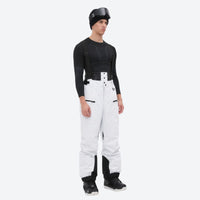 
                  
                    Men's adjustable ski pants with suspenders - white bib pants, on-model three-quarter front view, for deep powder winter days
                  
                