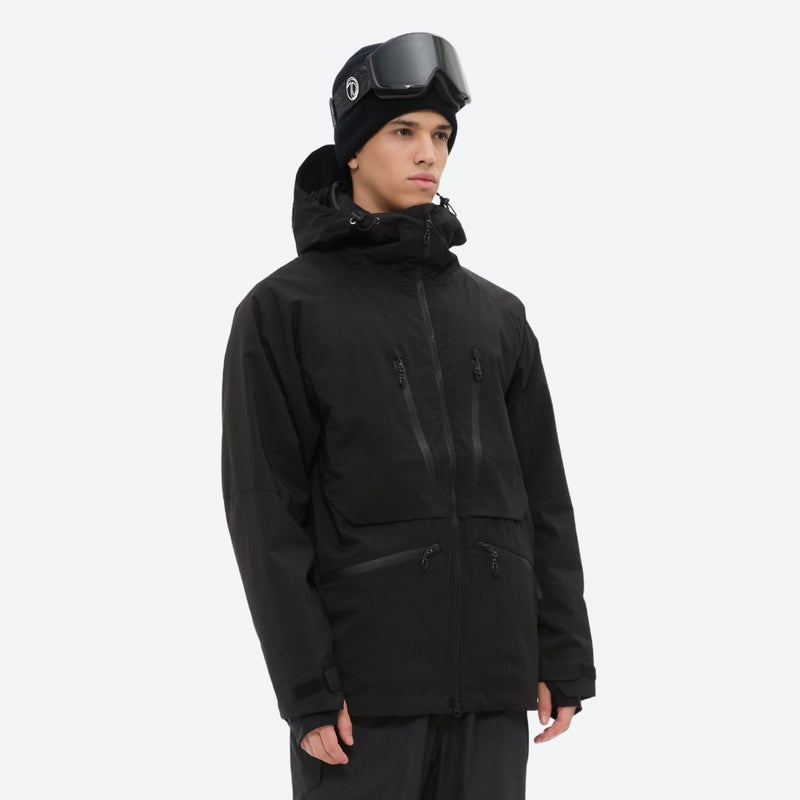Men's 3L waterproof suspender snow pants - black, on-model three-quarter front view, for cold-weather winter sports