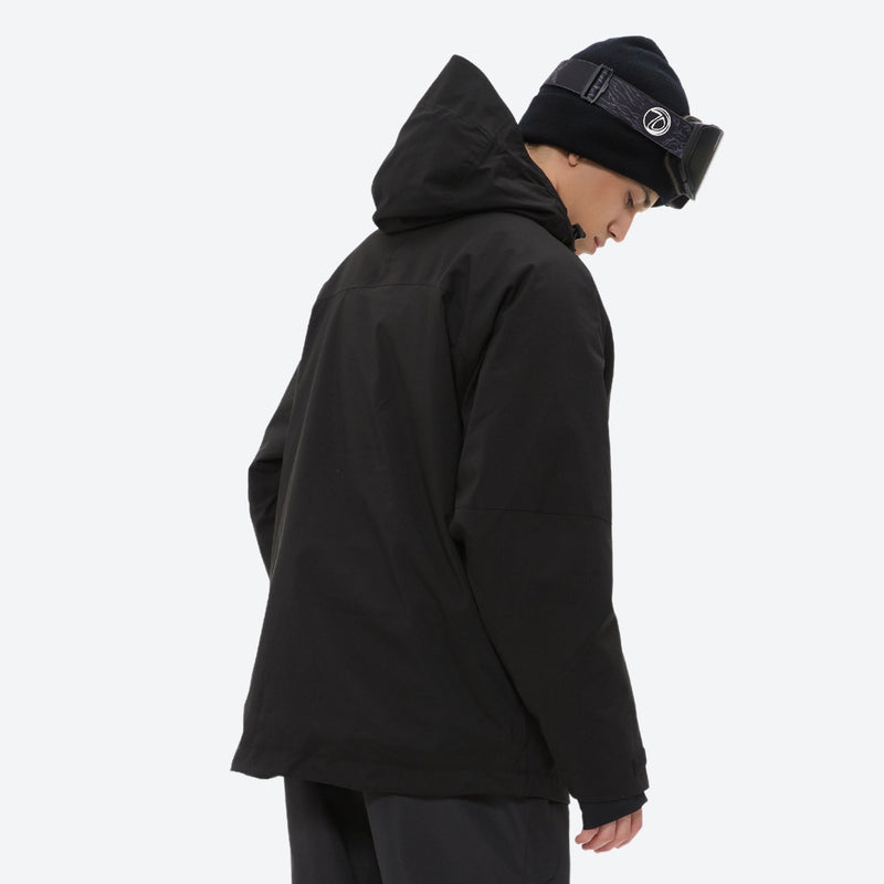 Men's adjustable ski pants with suspenders - black, on-model hood side view, for resort and backcountry days