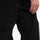 Men's adjustable snowboard cargo pants with gaiters - black, leg zip close-up with hand, for resort and backcountry days